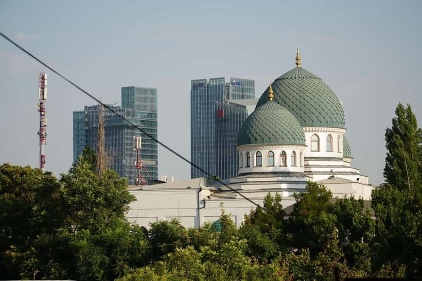 Tashkent city Night Tour with Dinner & Free Pro Photography - Monument of Courage and a serious side of Tashkent